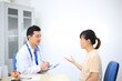© Worapon - Male doctor with experience examining young pregnant women