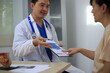 © Worapon - Male doctor with experience examining young pregnant women