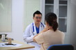 © Worapon - Male doctor with experience examining young pregnant women