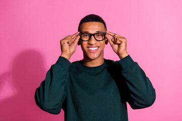 Wall Mural - Photo of handsome good mood guy wear sweatshirt arms spectacles emtpy space isolated pink color background