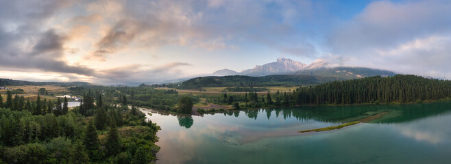 Wall Mural - Lake in Canadian Mountain Landscape. Dramatic Sunrise Sky