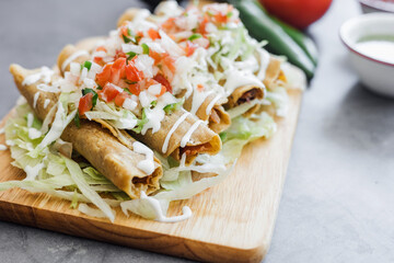 Wall Mural - Mexican tacos dorados called flautas with chicken, traditional fried food in Mexico Latin America	
