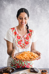 Mexican woman cooking rice with ingredients, traditional food in Mexico Latin America	