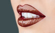 © Yevhen - Lip care and beauty. Sexy lips. Brown lip. Closeup sexy plump soft lips dark brown lipstick. Professional makeup lip gloss cosmetic product. Face skin mouth perfection flawless concept