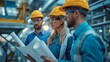 © acnaleksy - group of engineers discussing blueprints and planning the design