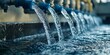 © AminaDesign - A vibrant and dynamic view of water steadily flowing from industrial pipes, showcasing both efficiency and fluidity