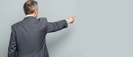 Wall Mural - businessman pointing at copy space for advertising