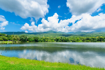 Wall Mural - a public place leisure travel landscape lake views at Ang Kaew Chiang Mai University and Doi Suthep nature forest Mountain views spring cloudy sky background with white cloud.