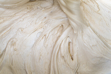 Background, texture of bread dough or pizza close-up. Copyspace