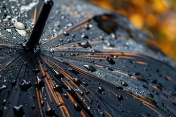 Sticker - A detailed view of a black umbrella with water droplets on the fabric, ideal for use in weather or nature-themed projects