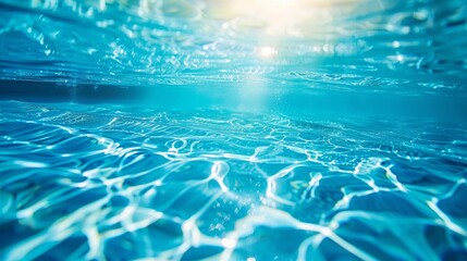 Wall Mural - blue water of swimming pool with sun light and ripples background