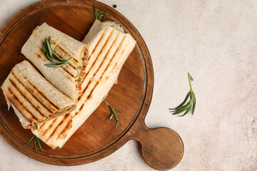 Wall Mural - Board with tasty shawarma and rosemary on white background