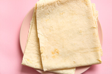 Poster - Plate with fresh thin lavash on pink background