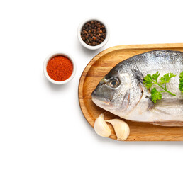 Poster - Wooden board of raw dorado fish with spices on white background