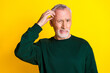 © deagreez - Photo portrait of lovely pensioner man confused scratch head dressed stylish green garment isolated on yellow color background