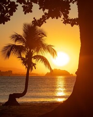 Wall Mural - Silhouette of a palm tree against a golden sunset over the ocean