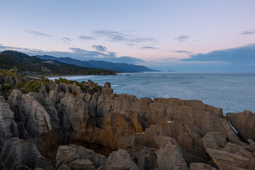 Wall Mural - Sunrise view of pancake rocks at Punakaiki, New Zealand.