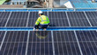 © ultramansk - Worker Technicians are working to construct solar panels system on roof. Installing solar photovoltaic panel system. Men technicians walking on roof structure to check photovoltaic solar modules.