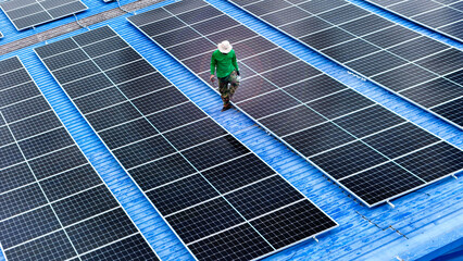Wall Mural - top aerial of engineer men inspects construction of solar cell panel or photovoltaic cell at roof to