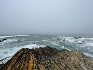 waves crashing on rocks