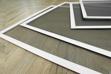 Wall Mural - Set of window screens on wooden floor