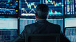 © Jirawatfoto - Modern Financial Trader Analyzing Stock Data on Multiple Monitors