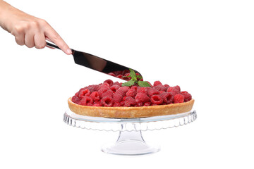 Wall Mural - PNG, Berry pie with raspberries on stand and hand with knife, isolated on white background