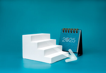 Wall Mural - Happy new year 2025 background. 2025 numbers on desk calendar near arrow decrease on white geometric stairway, isolated on blue background, minimalist. Downtrend business, goal and success concept.