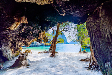 Wall Mural - View from a cave of the beautiful sandy beach of Koh Lao Lading  in the Andaman Sea of ​​Krabi Province, southern Thailand, Asia.