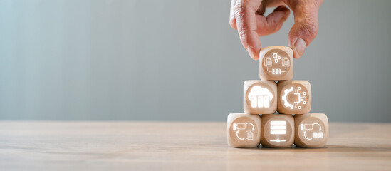 Wooden blocks with digital icons symbolizing Electronic Data Interchange (EDI) concept, showcasing modern data exchange and communication technology.