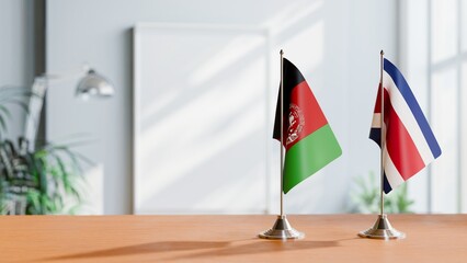 Wall Mural - FLAGS OF AFGHANISTAN AND COSTA RICA ON TABLE