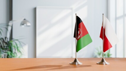 FLAGS OF AFGHANISTAN AND POLAND ON TABLE