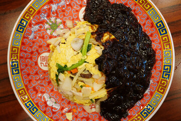 Wall Mural - Korean-style Chinese fried rice. It is usually topped with Jajang sauce.