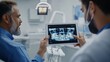 © Oulaphone - Dentist showing patient an X-ray on a tablet at clinic. dental surgery check-up.