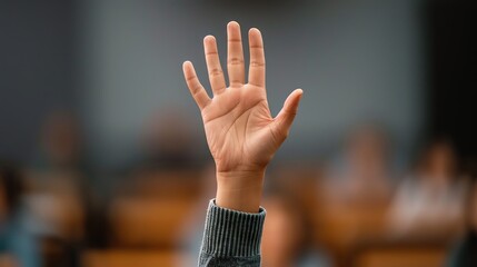 Attendees raising hands to ask questions at a conference.