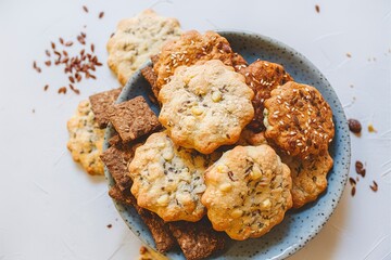 Wall Mural - Delicious healthy cookies crackers with flax seeds and sesame seeds on a plate