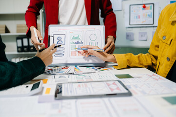 Wall Mural - ux developer and ui designer brainstorming about mobile app interface wireframe design with customer