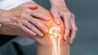© JAYDA RIN - A close-up of an elderly person s hand gently massaging their knee, with an overlay of glowing bones, symbolizing the care and attention needed to maintain joint and bone health