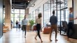 © Johannes - blurred motion of diverse businesspeople walking in modern office building coworking and collaboration concept abstract photo