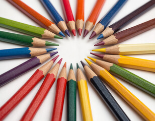 Many different colored pencils on white background