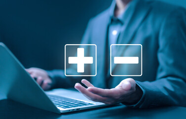 hand shows icon plus and minus, sign opposite negative positive. concept of comparing pros and cons, the decision to choose plus vs minus, versus good and bad 