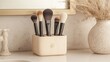 © Paul - Rustic wooden makeup brush holder with labeled compartments, displaying a mix of natural bristle brushes in a cozy vintage bathroom setting