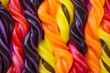 © Azhorov - Colorful twisted candy twists lined up, showcasing a variety of vibrant flavors and textures, perfect for sweet treats at a candy shop. Generative AI