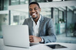 © TasJam/peopleimages.com - Portrait, business and black man at desk, laptop and entrepreneur with smile, internet and network. African person, face and consultant with computer, happiness and connection with confidence and pc