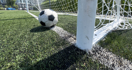 Black and white soccer and football ball in the field. Horizontal sport theme poster, greeting cards, headers, website and app