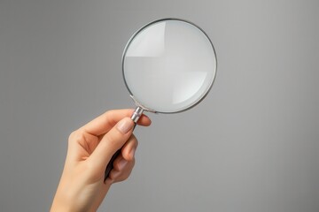 Magnifier. Female Hand Holding Magnifying Glass Over Gray Background Mock-Up Image for Business Advertising