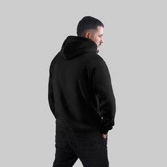 Wall Mural - Вlack hoodie mockup, sweatshirt on brutal man, back view, for design, print, pattern, branding.