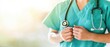 © JK_kyoto - Close-up of a healthcare professional wearing scrubs and a stethoscope, symbolizing compassion and dedication in patient care.