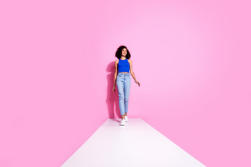 Wall Mural - Photo of girl smiling look empty space walk white road isolated pink color background