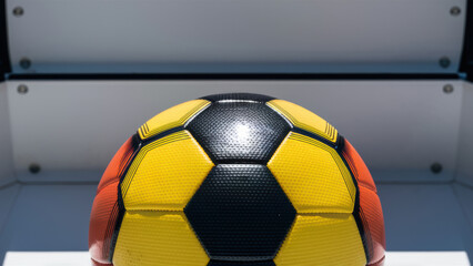 Sticker - A soccer ball with a yellow, black and red color scheme, AI